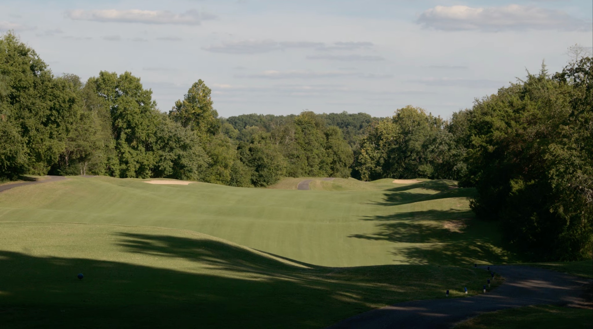 A broad Sycamore Creek fairway framed by mature trees